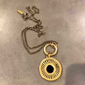 Long gold necklace w gold circular pendant